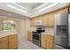 Well-equipped kitchen features stainless steel appliances, ample counter space and skylight for abundant natural light at 10884 Sw 53Rd Cir, Ocala, FL 34476