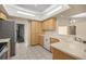 Bright kitchen featuring modern stainless steel appliances and tile flooring, perfect for culinary enthusiasts at 10884 Sw 53Rd Cir, Ocala, FL 34476