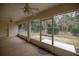 Screened-in porch provides views of the yard and greenery at 10884 Sw 53Rd Cir, Ocala, FL 34476