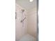 Close up of a shower with handheld shower and tile flooring at 10884 Sw 53Rd Cir, Ocala, FL 34476