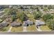 Aerial view of a neighborhood with mature trees, highlighting the property's location and surrounding community at 11862 Se 72Nd Terrace Rd, Belleview, FL 34420