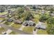 Aerial view of property showing home, driveway, street, and trees at 11862 Se 72Nd Terrace Rd, Belleview, FL 34420