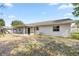 Exterior of home, featuring a screened in porch and a spacious backyard at 11862 Se 72Nd Terrace Rd, Belleview, FL 34420