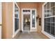 Covered entryway showcasing neutral tones, decorative accents, and a view into the home's interior at 13096 Se 93Rd Terrace Road, Summerfield, FL 34491