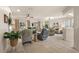 Open-concept living room showcasing tile flooring, comfortable seating, and sliding glass doors to the outdoor space at 13096 Se 93Rd Terrace Road, Summerfield, FL 34491