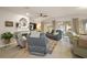 Comfortable living room featuring tile floors, fireplace, and sliding glass doors to the outside at 13096 Se 93Rd Terrace Road, Summerfield, FL 34491