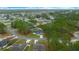 An aerial view of the home nestled among lush trees, offering privacy at 13105 Sw 73Rd Avenue Rd, Ocala, FL 34473