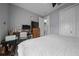 Bright bedroom featuring neutral walls, white bedding, a ceiling fan, and plenty of space for a desk or dresser at 13105 Sw 73Rd Avenue Rd, Ocala, FL 34473