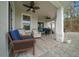 Relaxing covered patio with ceiling fans, comfortable seating and a dining table at 13105 Sw 73Rd Avenue Rd, Ocala, FL 34473