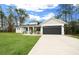 Well maintained single-story home features manicured front yard, a gray garage door, and welcoming curb appeal at 13105 Sw 73Rd Avenue Rd, Ocala, FL 34473