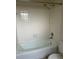 Bathroom with tiled shower, tub, and classic fixtures at 15 Clear Way, Ocala, FL 34472