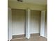 Bedroom closet with bi-fold doors, showing shelving for plenty of storage space at 15 Clear Way, Ocala, FL 34472