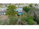 Beautiful aerial view of a home with a screened-in pool and lush greenery at 15052 Sw 43Rd Terrace Rd, Ocala, FL 34473