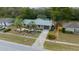 Aerial view of the home with stone accents, blue shutters, and landscaped front yard at 15052 Sw 43Rd Terrace Rd, Ocala, FL 34473