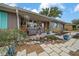 Inviting front porch with a seating area, surrounded by lush greenery at 15052 Sw 43Rd Terrace Rd, Ocala, FL 34473