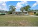 Charming single-story home with landscaped yard and beautiful palm trees at 15052 Sw 43Rd Terrace Rd, Ocala, FL 34473