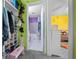 Hallway view of bathroom and bedroom with bright colors and ample shoe storage at 15052 Sw 43Rd Terrace Rd, Ocala, FL 34473