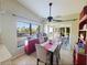 Cozy dining area featuring a ceiling fan, a sliding door, and neutral decor at 15857 Sw 11Th Terrace Rd, Ocala, FL 34473