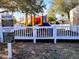 Summerglen playground surrounded by safety fence and shade trees features colorful play equipment for children at 15857 Sw 11Th Terrace Rd, Ocala, FL 34473