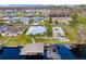 Aerial view of a waterfront community, showcasing dock, single Gathering homes, and serene water access at 1621 Yellow Brick Rd, Astor, FL 32102