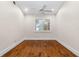 Empty bedroom with hardwood floors, natural light, and a simple, clean design at 1621 Yellow Brick Rd, Astor, FL 32102