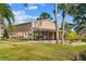 Exterior view of a large carport with covered parking, offering a functional design and picturesque surroundings at 1621 Yellow Brick Rd, Astor, FL 32102