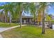 Dock overlooking the water with a covered seating area and idyllic setting, ideal for waterfront relaxation at 1621 Yellow Brick Rd, Astor, FL 32102