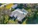 Beautiful aerial view of the home showcasing its lush landscaping and screened pool area at 1712 Ne 40Th Ave, Ocala, FL 34470