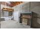 Basement with painted cinder block walls and exposed joists at 1712 Ne 40Th Ave, Ocala, FL 34470