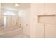 Bright bathroom featuring a soaking tub, large vanity mirror, and ample cabinet space at 1712 Ne 40Th Ave, Ocala, FL 34470