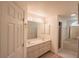 Bright bathroom featuring a double sink vanity, tub and walk-in shower at 1712 Ne 40Th Ave, Ocala, FL 34470