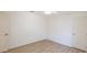 Bright bedroom with wood look floors features ample space and natural light at 1712 Ne 40Th Ave, Ocala, FL 34470