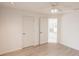 Bright bedroom features updated wood floors and access to another room at 1712 Ne 40Th Ave, Ocala, FL 34470