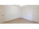 Bedroom featuring neutral walls, light wood floors, and traditional doors at 1712 Ne 40Th Ave, Ocala, FL 34470