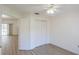 Bright bedroom features wood look floors, a ceiling fan, and double closet at 1712 Ne 40Th Ave, Ocala, FL 34470