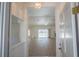 Bright and airy foyer leading into a spacious living area with wood floors and views of the pool at 1712 Ne 40Th Ave, Ocala, FL 34470