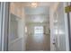 Bright living room with wood floors, high ceilings and sliding glass doors leading to the pool area at 1712 Ne 40Th Ave, Ocala, FL 34470