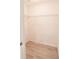 Spacious walk-in closet with custom shelving and wood look floors at 1712 Ne 40Th Ave, Ocala, FL 34470