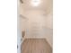 Walk-in closet features custom shelving and laminate wood flooring at 1712 Ne 40Th Ave, Ocala, FL 34470