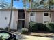 Condo exterior features a well-maintained lawn and mature palm trees at 2857 Sw 32Nd Ave, Ocala, FL 34474