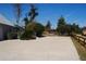 Long concrete driveway leading to a fenced yard, offering ample parking and outdoor space at 3560 Sw 24Th Avenue Rd, Ocala, FL 34471