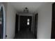 Well-lit entryway with hardwood floors leading to various rooms, offering a glimpse into the home's layout at 3560 Sw 24Th Avenue Rd, Ocala, FL 34471