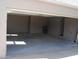 Open garage with finished walls and ceiling at 3560 Sw 24Th Avenue Rd, Ocala, FL 34471