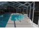 View of a screened pool area with a pool, a handrail, white decking, and privacy screening at 3560 Sw 24Th Avenue Rd, Ocala, FL 34471