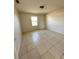 Neutral bedroom with tile flooring, one window for natural lighting at 3940 Sw 138Th Pl, Ocala, FL 34473