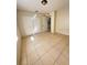 Bright bedroom with tile flooring and double closet doors at 3940 Sw 138Th Pl, Ocala, FL 34473