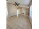 Open living room featuring tile floors and a ceiling fan at 3940 Sw 138Th Pl, Ocala, FL 34473