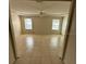 Bright living room filled with natural light from the two windows at 3940 Sw 138Th Pl, Ocala, FL 34473