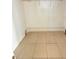 Walk-in closet with tile floor and metal shelving for organized storage at 3940 Sw 138Th Pl, Ocala, FL 34473