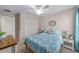 Bright bedroom featuring a ceiling fan, closet, and comfortable furnishings at 5094 Se 89Th St, Ocala, FL 34480